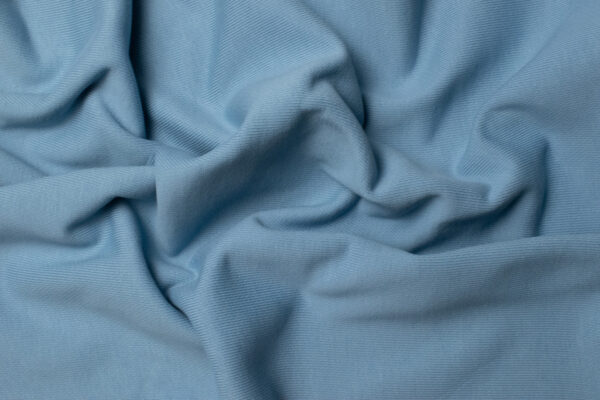 Тринитка оптом від All-Tex: види, склад і практичне застосування у виробництві одягу